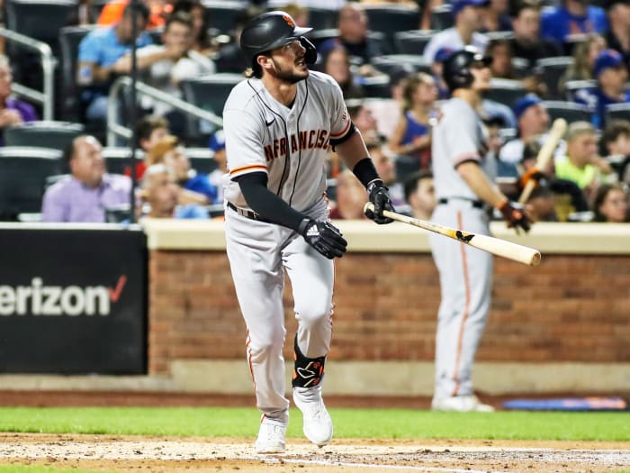 Aug 25, 2021; New York City, New York, USA;  San Francisco Giants third baseman Kris Bryant (23) hits a solo home run in the fourth inning against the New York Mets at Citi Field.